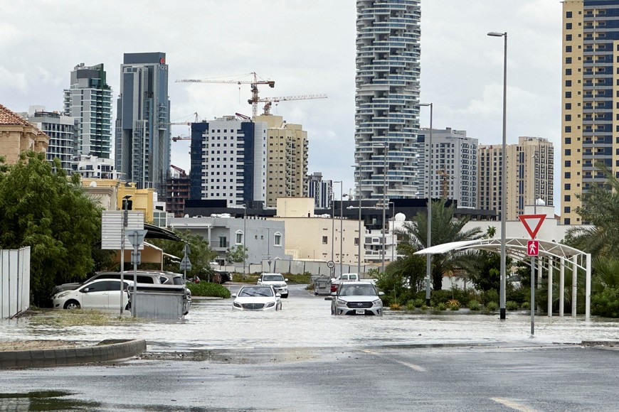 Cars drive through a flooded street during a rain storm in Dubai, United Arab Emirates, April 16, 2024. REUTERS/Abdel Hadi Ramahi