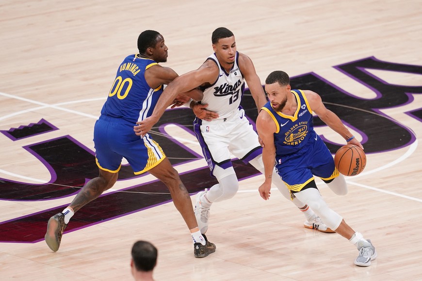 Apr 16, 2024; Sacramento, California, USA; Golden State Warriors guard Stephen Curry (30) dribbles the ball next to Sacramento Kings forward Keegan Murray (13) in the third quarter during a play-in game of the 2024 NBA playoffs at the Golden 1 Center. Mandatory Credit: Cary Edmondson-USA TODAY Sports