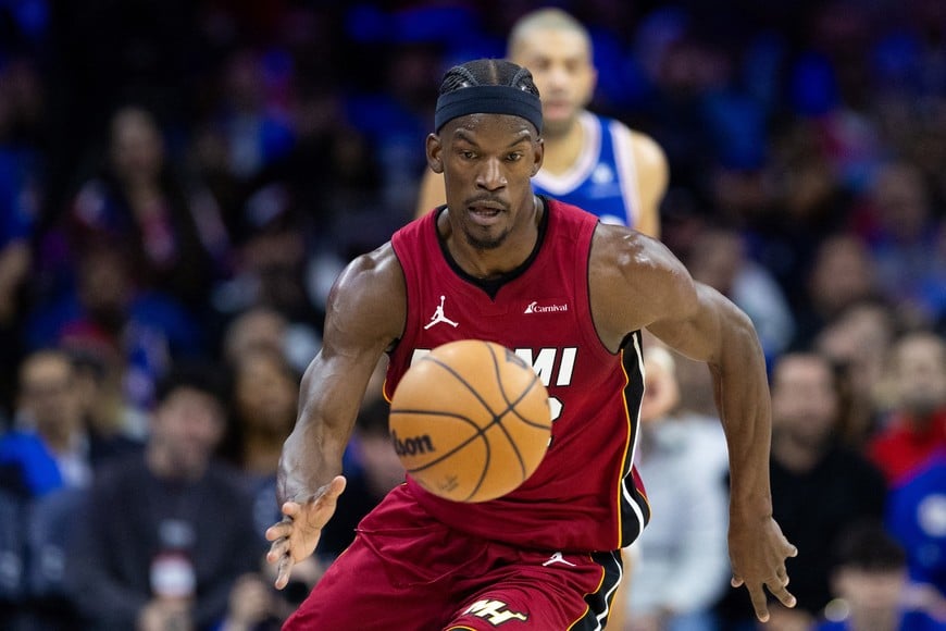 Apr 17, 2024; Philadelphia, Pennsylvania, USA; Miami Heat forward Jimmy Butler (22) picks up a loose ball against the Philadelphia 76ers during the second quarter of a play-in game of the 2024 NBA playoffs at Wells Fargo Center. Mandatory Credit: Bill Streicher-USA TODAY Sports