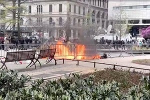 SENSITIVE MATERIAL. THIS IMAGE MAY OFFEND OR DISTURB    A person is covered in flames outside the courthouse where former U.S. President Donald Trump's criminal hush money trial is underway, in New York, U.S., April 19, 2024, in this screen grab taken from a video. Reuters TV via REUTERS