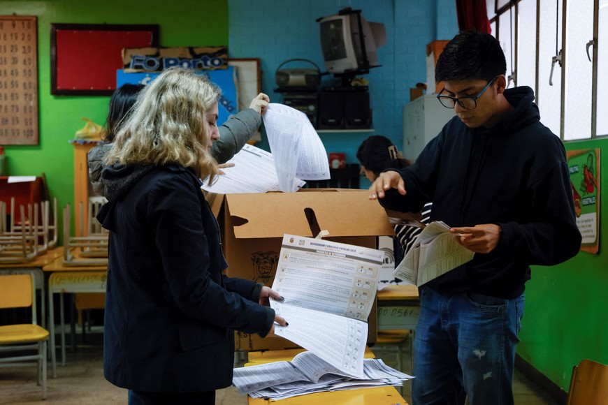 Ballots are sorted ahead of the counting process in a referendum that asks voters to support mostly security-related questions to fight rising violence, in Quito, Ecuador April 21, 2024. REUTERS/Karen Toro