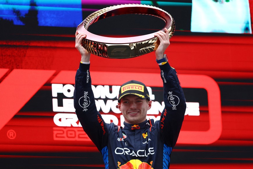 Formula One F1 - Chinese Grand Prix - Shanghai International Circuit, Shanghai, China - April 21, 2024
Red Bull's Max Verstappen celebrates with the trophy on the podium after winning the Chinese Grand Prix REUTERS/Edgar Su
