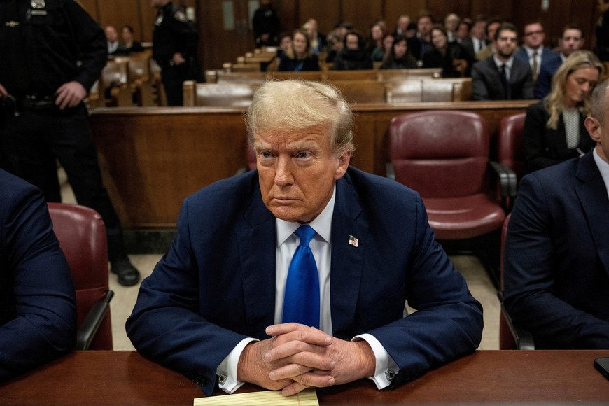 Former U.S. president and Republican presidential candidate Donald Trump sits in court on the first day of opening statements in his trial at Manhattan Criminal Court for falsifying documents related to hush money payments, in New York, U.S.,  April 22, 2024. Victor J. Blue/Pool via REUTERS
