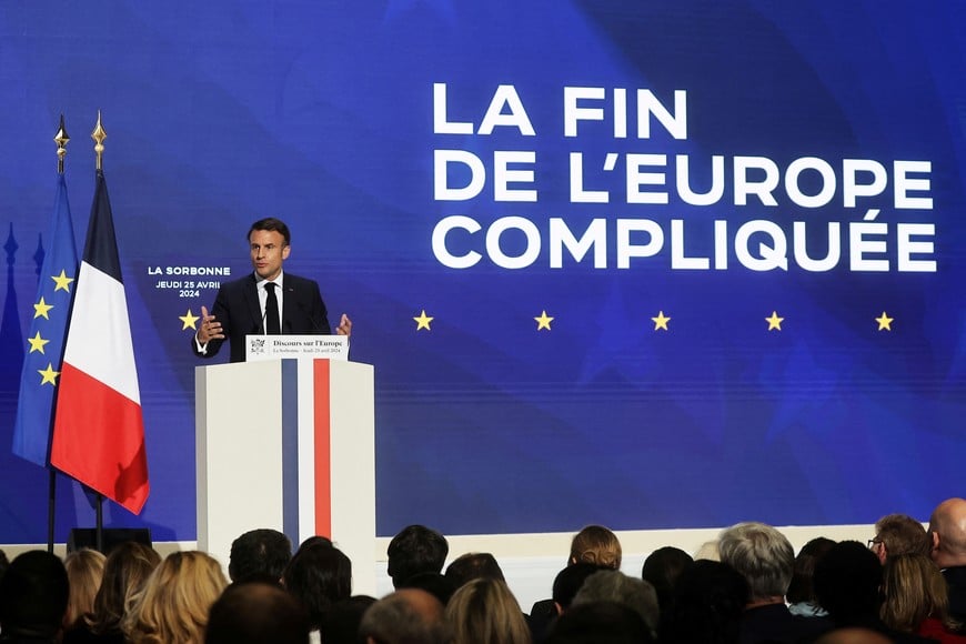 French President Emmanuel Macron delivers a speech on Europe next to a slogan reading 'The end of a complicated Europe' in the amphitheatre of the Sorbonne University in Paris, France, 25 April 2024. Christophe Petit Tesson/Pool via REUTERS
