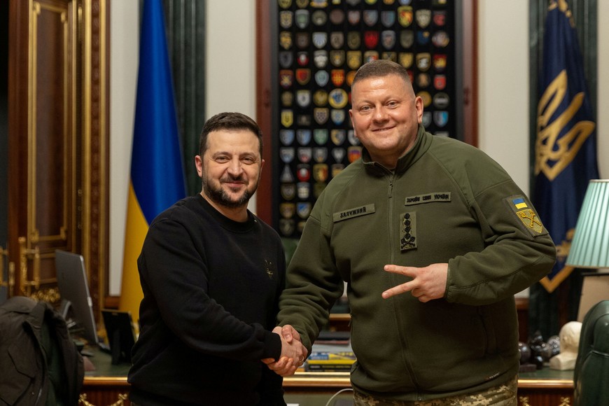 Ukraine's President Volodymyr Zelenskiy and Commander in Chief of the Ukrainian Armed Forces Valerii Zaluzhnyi shake hand and pose for a picture during their meeting, amid Russia's attack on Ukraine, in Kyiv, Ukraine February 8, 2024. Ukrainian Presidential Press Service/Handout via REUTERS ATTENTION EDITORS - THIS IMAGE HAS BEEN SUPPLIED BY A THIRD PARTY.