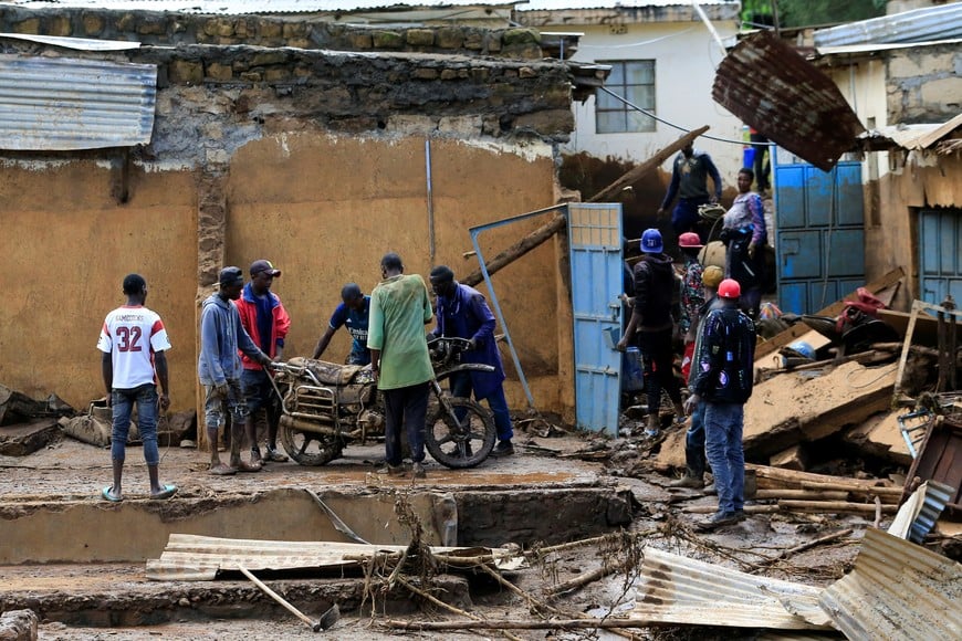 Residents attempt to salvage property from the ruins of their houses after heavy flash floods wiped out several homes when a dam burst, following heavy rains in Kamuchiri village of Mai Mahiu, Nakuru County, Kenya April 29, 2024. REUTERS/Thomas Mukoya