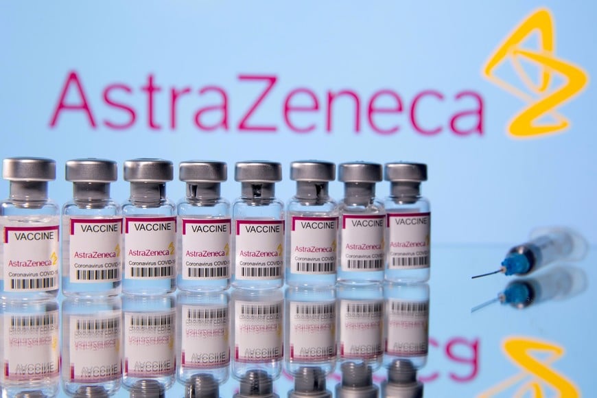 FILE PHOTO: Vials labelled "Astra Zeneca COVID-19 Coronavirus Vaccine" and a syringe are seen in front of a displayed AstraZeneca logo, in this illustration photo taken March 14, 2021. REUTERS/Dado Ruvic/File Photo