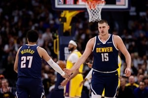 Apr 29, 2024; Denver, Colorado, USA; Denver Nuggets center Nikola Jokic (15) and guard Jamal Murray (27) in the first quarter against the Los Angeles Lakers during game five of the first round for the 2024 NBA playoffs at Ball Arena. Mandatory Credit: Isaiah J. Downing-USA TODAY Sports