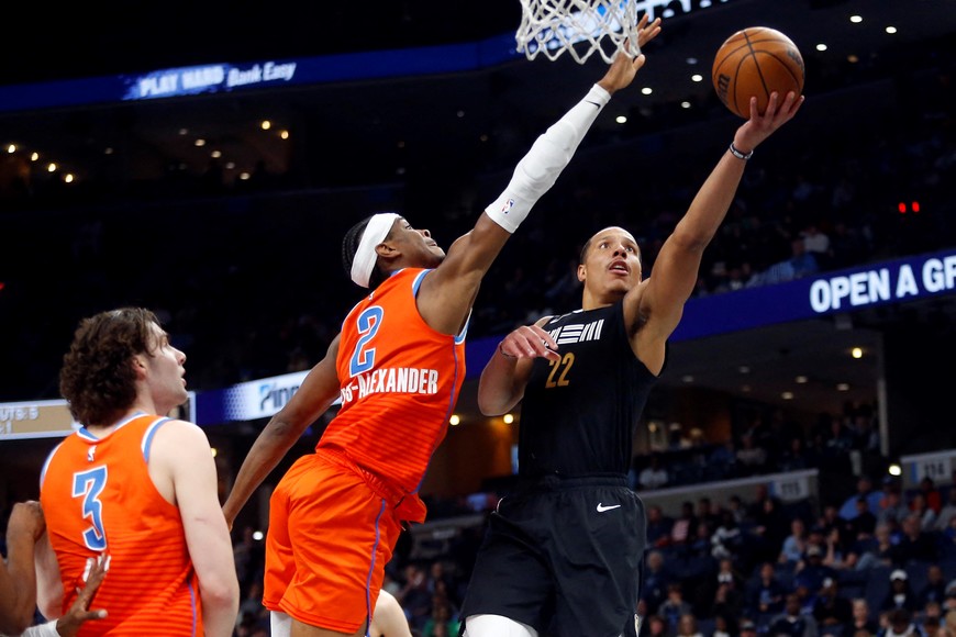 Mar 16, 2024; Memphis, Tennessee, USA; Memphis Grizzlies guard Desmond Bane (22) shoots as Oklahoma City Thunder guard Shai Gilgeous-Alexander (2) defends during the second half at FedExForum. Mandatory Credit: Petre Thomas-USA TODAY Sports