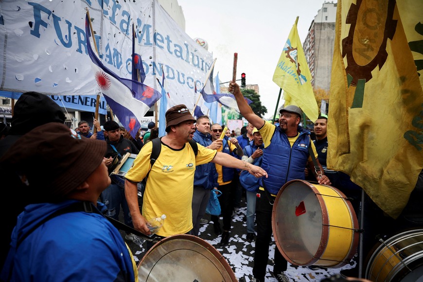 People play drums, as union members participate in a march during May Day celebrations, in Buenos Aires, Argentina, May 1, 2024. REUTERS/Agustin Marcarian