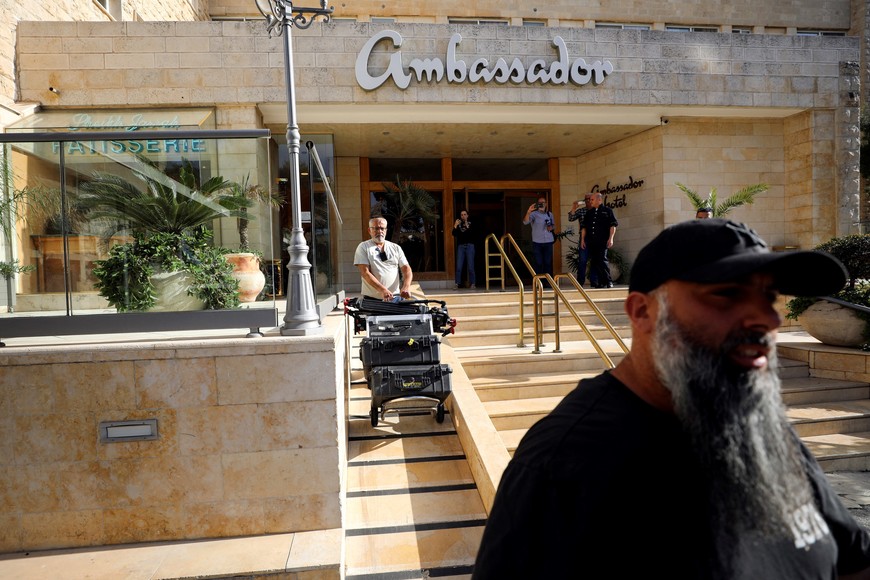 A man maneuvers media equipment following an Israeli police raid on an Al Jazeera de facto office at the Ambassador Hotel in Jerusalem, May 5, 2024. REUTERS/Jamal Awad