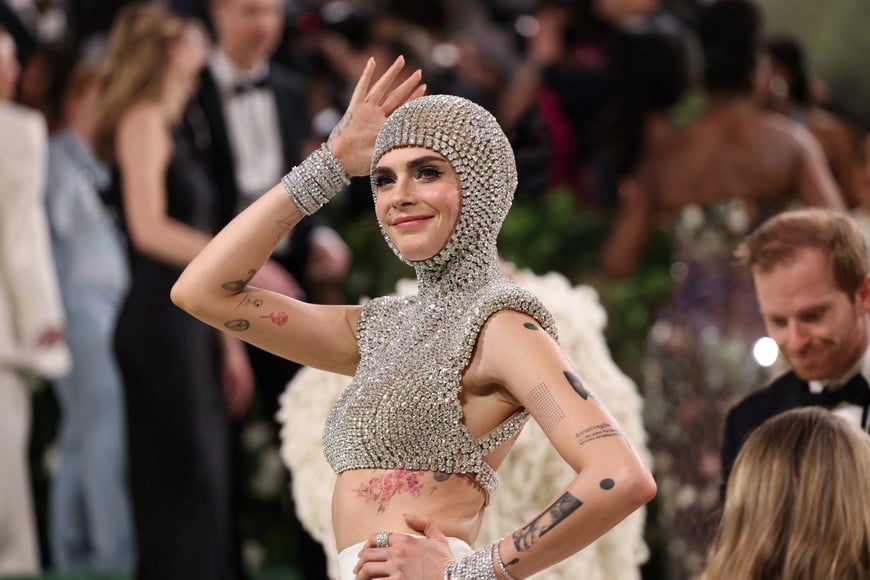 Cara Delevingne poses at the Met Gala, an annual fundraising gala held for the benefit of the Metropolitan Museum of Art's Costume Institute with this year's theme 'Sleeping Beauties: Reawakening Fashion' in New York City, New York, U.S., May 6, 2024. REUTERS/Andrew Kelly