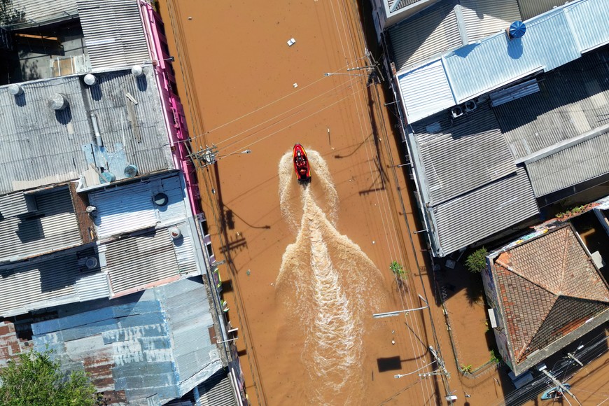 A drone shows rescue workers driving a boat at a flooded street in Porto Alegre, Rio Grande do Sul, Brazil, May 7, 2024. REUTERS/Diego Vara