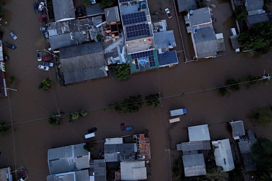 A drone view shows the Brazilian flag painted on a house as streets are flooded in Eldorado do Sul, Rio Grande do Sul state, Brazil, May 9, 2024. REUTERS/Amanda Perobelli
