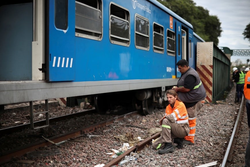 Rescue team staff works on the site of a train collision in Buenos Aires, Argentina, May 10, 2024. REUTERS/Agustin Marcarian