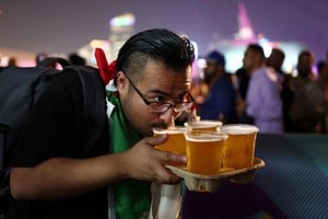 Soccer Football - FIFA World Cup Qatar 2022 - FIFA Fan Festival Opening - FIFA Fan Festival at Al Bidda Park, Doha, Qatar - November 19, 2022
A fan drinks a beer during the opening of the FIFA fan festival REUTERS/Marko Djurica