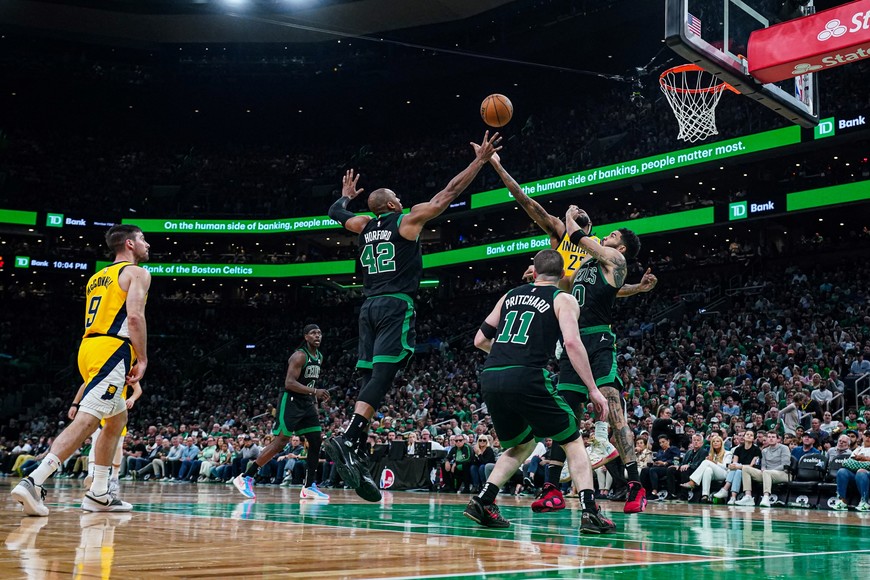 May 23, 2024; Boston, Massachusetts, USA; Boston Celtics center Al Horford (42) and forward Jayson Tatum (0) work for the ball against Indiana Pacers forward Isaiah Jackson (22) in the second half during game two of the eastern conference finals for the 2024 NBA playoffs at TD Garden. Mandatory Credit: David Butler II-USA TODAY Sports