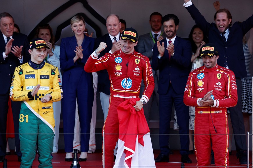 Formula One F1 - Monaco Grand Prix - Circuit de Monaco, Monaco - May 26, 2024
Ferrari's Charles Leclerc celebrates on the podium after winning the Monaco Grand Prix alongside second place McLaren's Oscar Piastri and third place Ferrari's Carlos Sainz Jr. REUTERS/Benoit Tessier