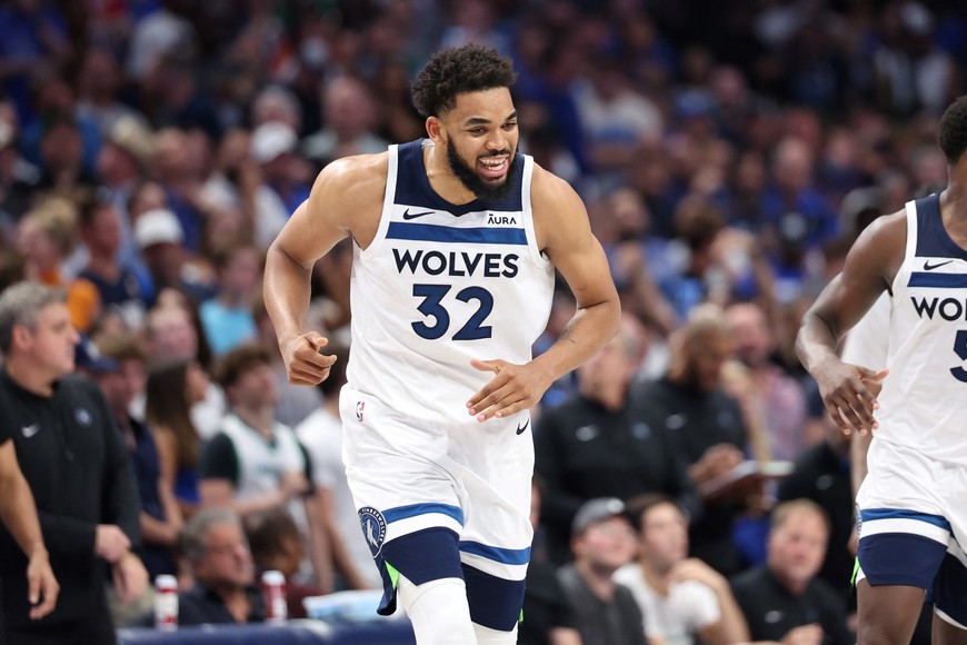 May 28, 2024; Dallas, Texas, USA; Minnesota Timberwolves center Karl-Anthony Towns (32) reacts against the Dallas Mavericks during the fourth quarter of game four of the western conference finals for the 2024 NBA playoffs at American Airlines Center. Mandatory Credit: Kevin Jairaj-USA TODAY Sports