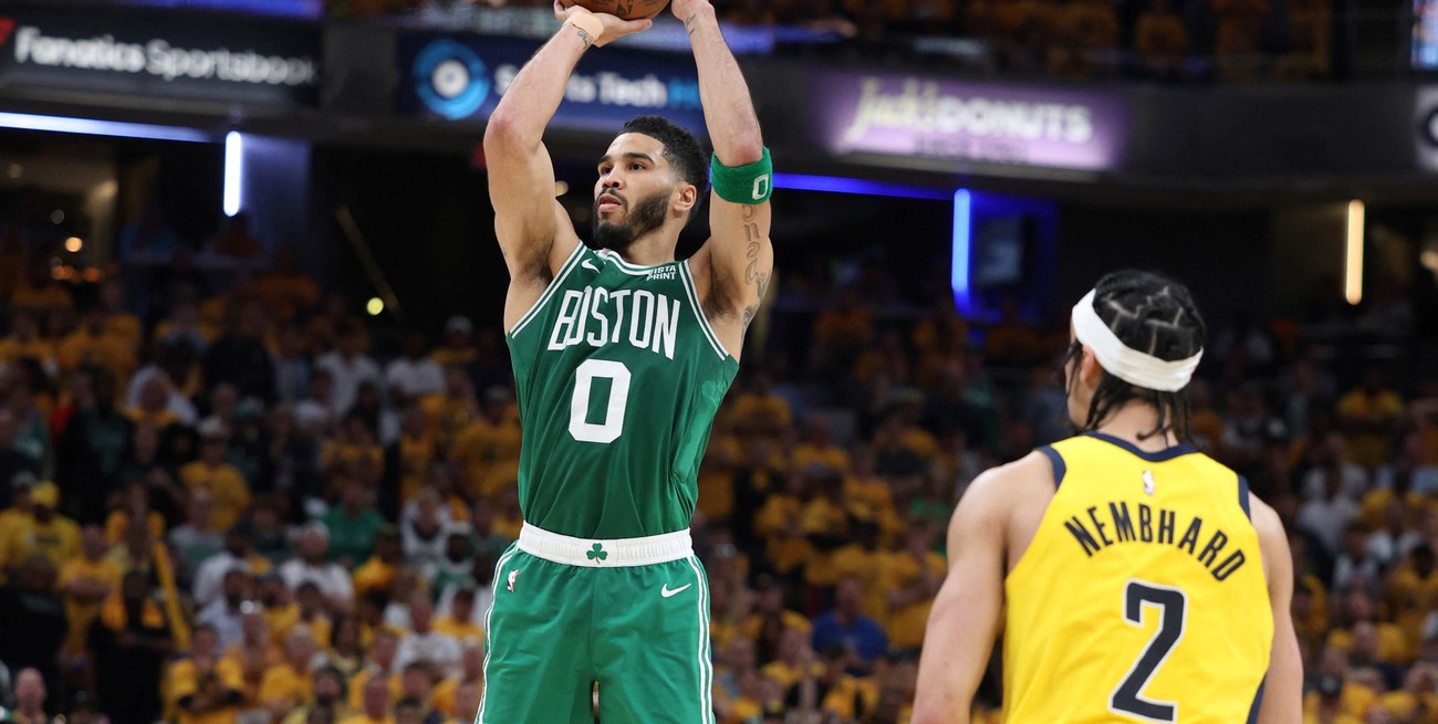May 25, 2024; Indianapolis, Indiana, USA; Boston Celtics forward Jayson Tatum (0) shoots the ball against Indiana Pacers guard Andrew Nembhard (2) during the fourth quarter of game three of the eastern conference finals in the 2024 NBA playoffs at Gainbridge Fieldhouse. Mandatory Credit: Trevor Ruszkowski-USA TODAY Sports