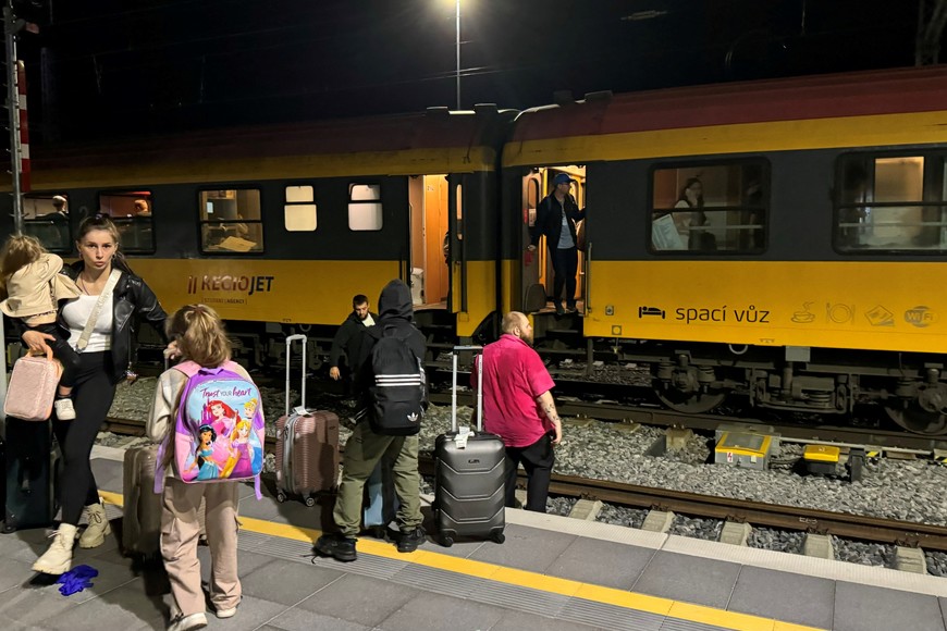 People stand near a train following a collision between a passenger train and a freight train in Pardubice, Czech Republic, June 5, 2024 in this picture obtained from social media.  Jiri Sejkora/via REUTERS  THIS IMAGE HAS BEEN SUPPLIED BY A THIRD PARTY. MANDATORY CREDIT. NO RESALES. NO ARCHIVES.