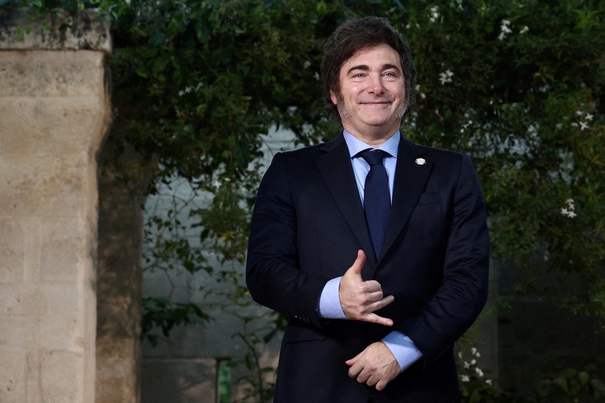 Argentina’s President Javier Milei gestures, as G7 leaders and representatives of States and International Organisations gather for a family photo on the second day of the G7 summit at the Borgo Egnazia resort, in Savelletri, Italy June 14, 2024. REUTERS/Guglielmo Mangiapane