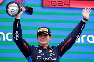 Formula One F1 - Spanish Grand Prix - Circuit de Barcelona-Catalunya, Barcelona, Spain - June 23, 2024
Red Bull's Max Verstappen celebrates with a trophy on the podium after winning the Spanish Grand Prix REUTERS/Albert Gea