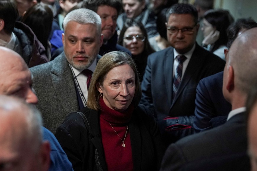 U.S. Ambassador to Russia Lynne Tracy waits inside a court building before the hearing of Russian veteran human rights campaigner Oleg Orlov's case in Moscow, Russia, February 27, 2024. Orlov was sentenced to two and a half years in prison after he was found guilty of discrediting Russia's armed forces. REUTERS/Tatyana Makeyeva