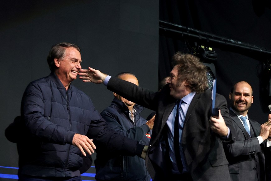 Argentine President Javier Milei gestures near Brazil's former president Jair Bolsonaro, as he speaks during the CPAC (Conservative Political Action Conference) in Balneario Camboriu, Santa Catarina state, Brazil July 7, 2024. REUTERS/Anderson Coelho