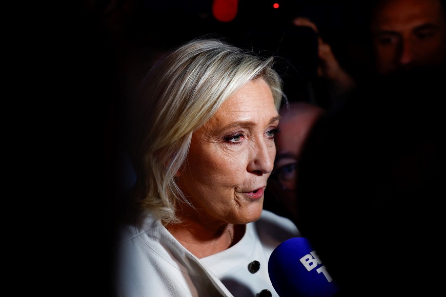 French far-right leader Marine Le Pen talks to journalists after partial results in the second round of the early French parliamentary elections, at the French far-right Rassemblement National (National Rally - RN) party venue in Paris, France, July 7, 2024. REUTERS/Sarah Meyssonnier