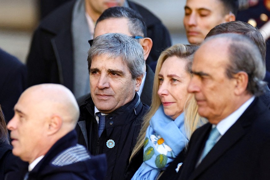 Argentina's Economy minister Luis Caputo and Argentina's President Javier Milei's sister and General Secretary of the Presidency of the Argentine Nation Karina Milei walk towards the Buenos Aires' Cathedral for the traditional Te Deum to commemorate the 214th anniversary of the May Revolution, in Buenos Aires, Argentina, May 25, 2024. REUTERS/Agustin Marcarian