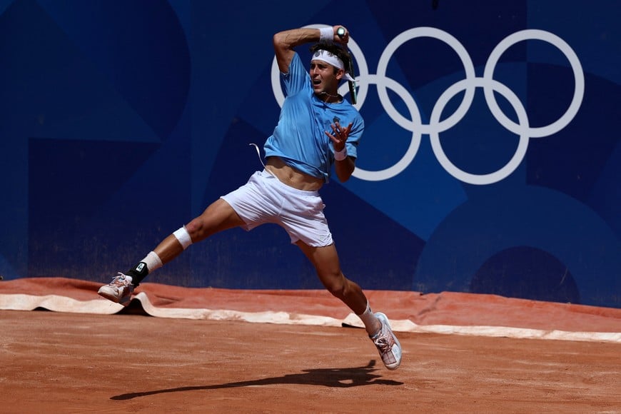 Paris 2024 Olympics - Tennis - Men's Singles First Round - Roland-Garros Stadium, Paris, France - July 28, 2024.
Tomas Martin Etcheverry of Argentina in action during his first round match against Thiago Seyboth Wild of Brazil. REUTERS/Violeta Santos Moura