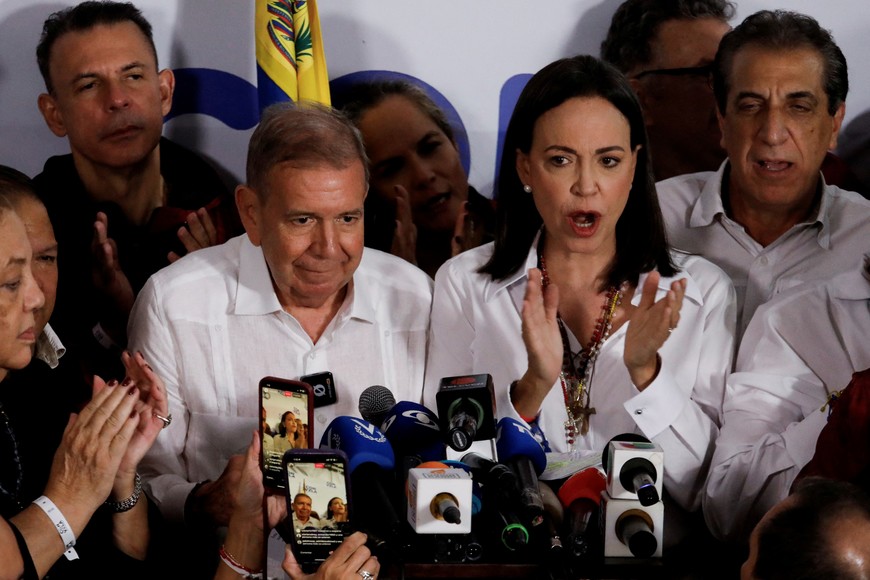 Venezuelan opposition leader Maria Corina Machado and opposition presidential candidate Edmundo Gonzalez react after the electoral authority announced that Venezuelan President Nicolas Maduro has won a third term, during the presidential election, in Caracas, Venezuela July 29, 2024. REUTERS/Leonardo Fernandez Viloria