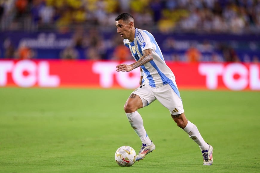 Jul 14, 2024; Miami, FL, USA; Argentina midfielder Angel Di Maria (11) controls the ball against Colombia in the second half during the Copa America Final at Hard Rock Stadium. Mandatory Credit: Nathan Ray Seebeck-USA TODAY Sports