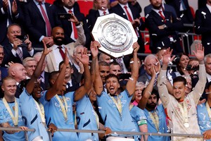 Soccer Football - Community Shield - Manchester United v Manchester City - Wembley Stadium, London, Britain - August 10, 2024
Manchester City's Ruben Dias celebrates with the trophy after winning the Community Shield Action Images via Reuters/Andrew Couldridge     TPX IMAGES OF THE DAY