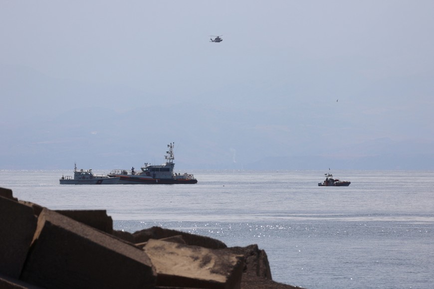 Emergency services work near the scene where a sailboat sank in the early hours of Monday off the coast of Porticello, near the Sicilian city of Palermo, Italy, August 19, 2024. REUTERS/Igor Petyx