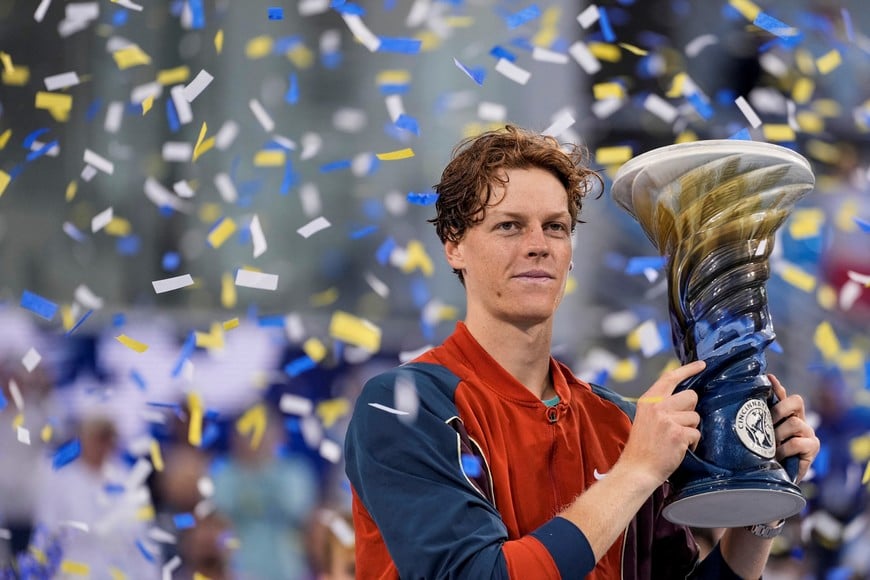 Aug 19 2024; Cincinnati, OH, USA; Jannik Sinner of Italy accepts the Rookwood Cup championship trophy after defeating Frances Tiafoe of the United States in the men’s singles final on day seven of the Cincinnati Open. Mandatory Credit: Sam Greene-The Cincinnati Enquirer/USA TODAY Sports