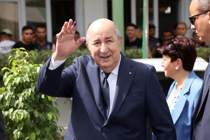 Algerian President and presidential candidate Abdelmadjid Tebboune gestures outside a polling station, during the presidential election in Algiers, Algeria September 7, 2024. Algerian Presidency/ Handout via REUTERS ATTENTION EDITORS - THIS IMAGE WAS PROVIDED BY A THIRD PARTY NO RESALES. NO ARCHIVES.