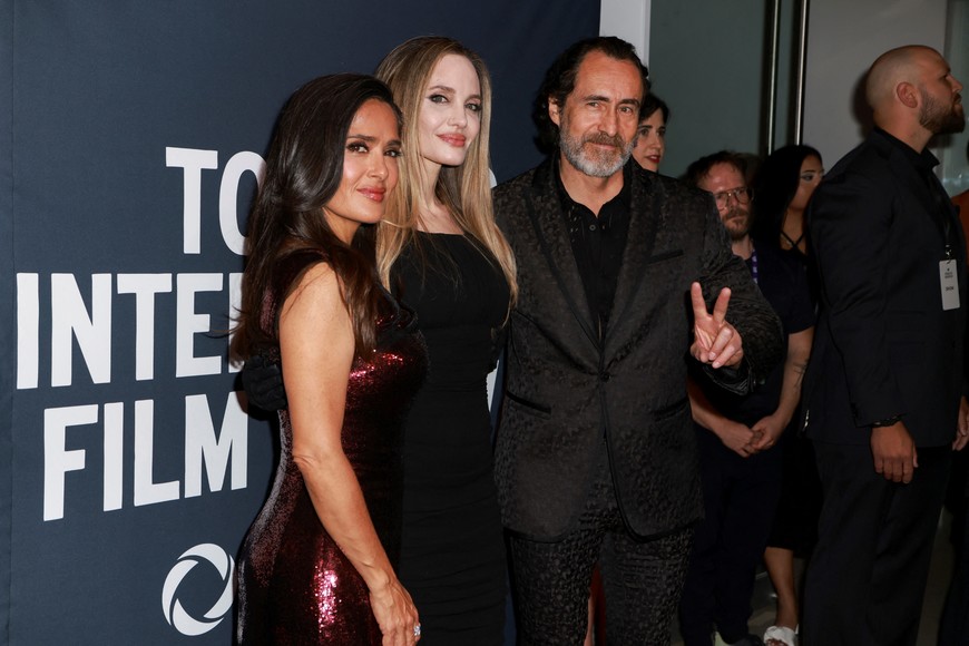 Director Angelina Jolie posed with actors Salma Hayek and Demian Bichir on the red carpet before "Without Blood" is screened as the Toronto International Film Festival (TIFF) returns for its 49th edition in Toronto, Ontario, Canada September 8, 2024. REUTERS/Carlos Osorio