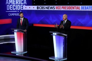 Democratic vice presidential nominee Minnesota Governor Tim Walz gestures as he speaks during a debate with Republican vice presidential nominee U.S. Senator JD Vance (R-OH) hosted by CBS in New York, U.S., October 1, 2024. REUTERS/Mike Segar