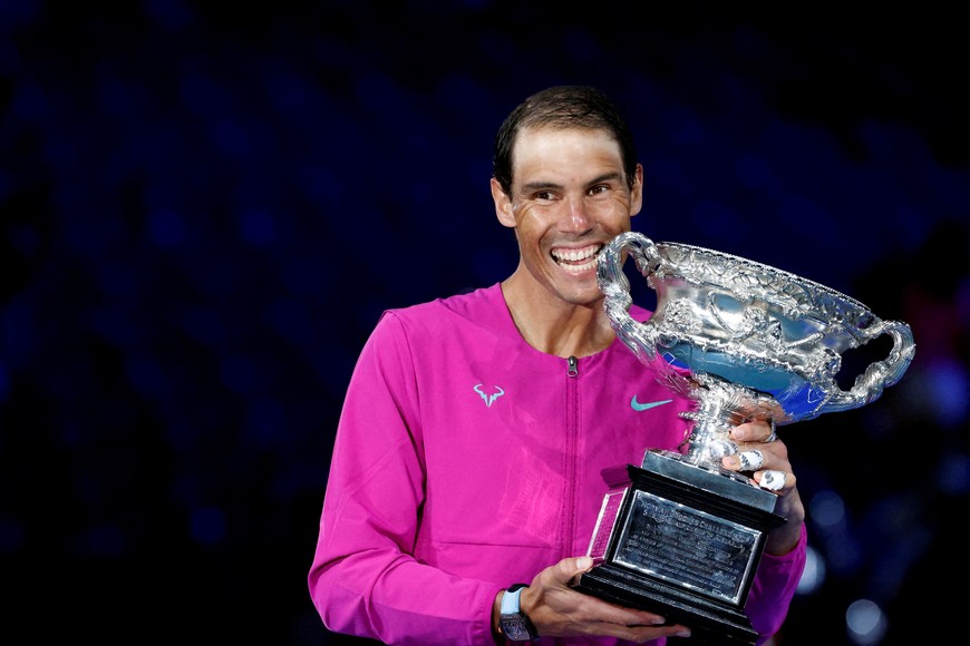 FILE PHOTO: Tennis - Australian Open - Men's Singles Final - Melbourne Park, Melbourne, Australia - January 31, 2022
Spain's Rafael Nadal celebrates after winning the men's singles final with trophy REUTERS/Asanka Brendon Ratnayake/File Photo