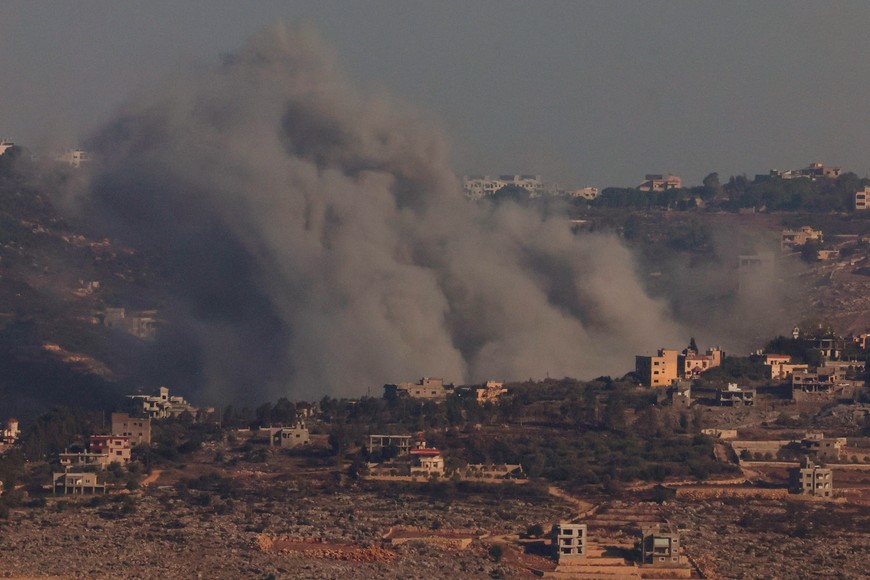 Smoke billows over southern Lebanon, amid ongoing hostilities between Hezbollah and Israeli forces, as seen from northern Israel, October 26, 2024. REUTERS/Gonzalo Fuentes