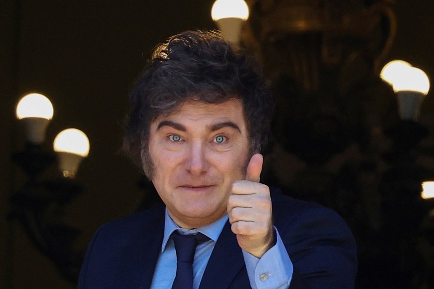 Argentina's President Javier Milei gestures from a balcony of the Casa Rosada Government House during the visit of Italy's Prime Minister Giorgia Meloni (not pictured), in Buenos Aires, Argentina November 20, 2024. REUTERS/Agustin Marcarian