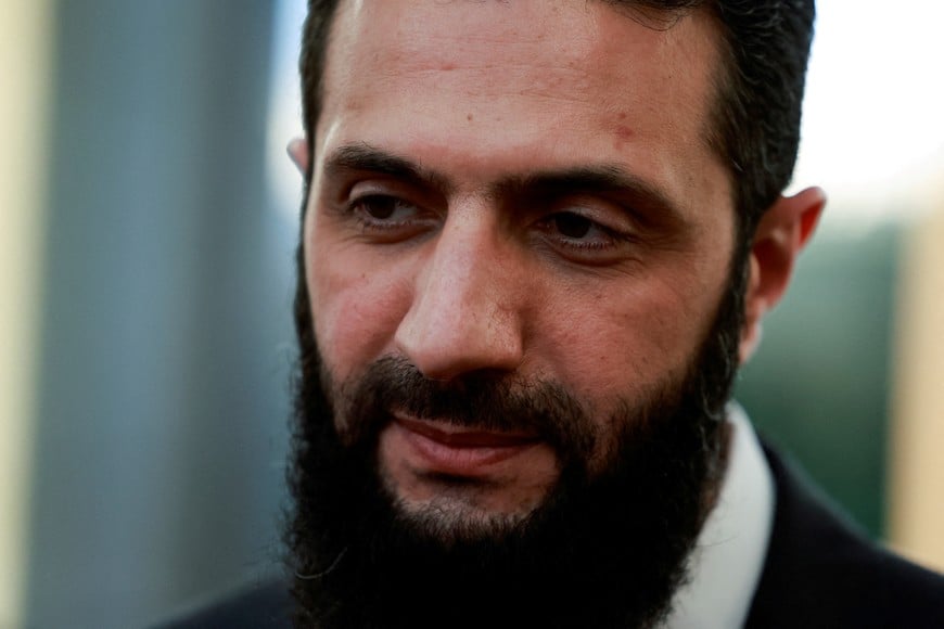 FILE PHOTO: Syria's de facto leader Ahmed al-Sharaa, also known as Abu Mohammed al-Golani, speaks to the media on the day he meets with Qatar's Minister of State Mohammed bin Abdulaziz Al-Khulaifi, after the ousting of Syria's Bashar al-Assad, in Damascus, Syria, December 23, 2024. REUTERS/Ammar Awad/File Photo