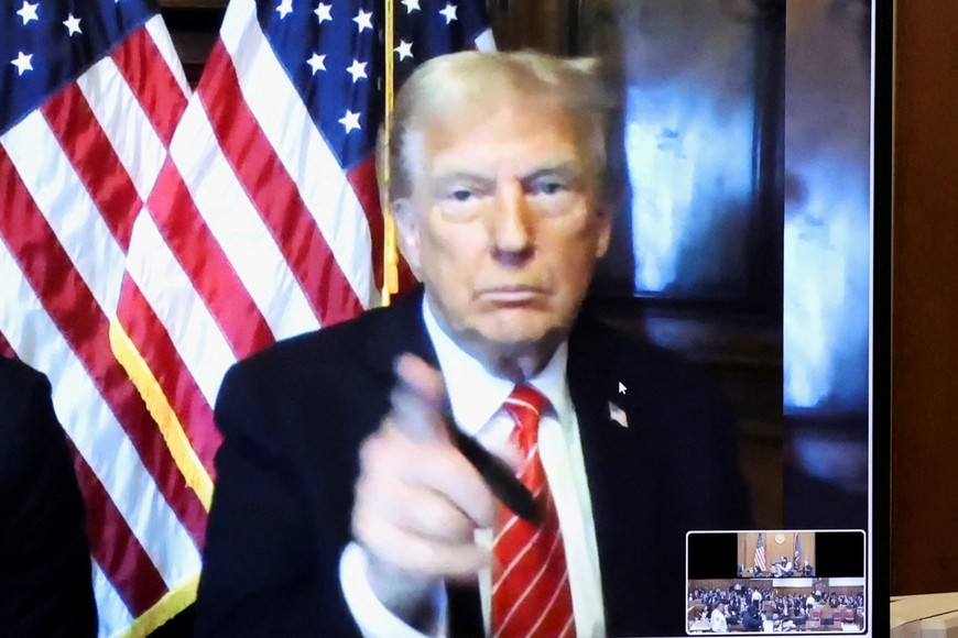 U.S. President-elect Donald Trump appears remotely for a sentencing hearing in front of New York State Judge Juan Merchan in the criminal case in which he was convicted in 2024 on charges involving hush money paid to a porn star, at New York Criminal Court in Manhattan in New York City, U.S., January 10, 2025. REUTERS/Brendan McDermid/Pool

     TPX IMAGES OF THE DAY