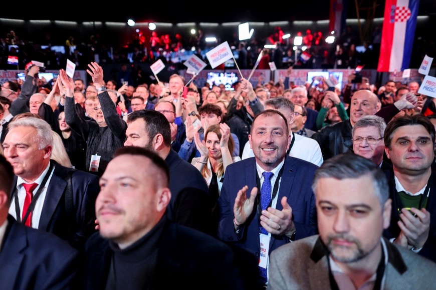 Supporters of Croatian President and presidential candidate Zoran Milanovic react to the first unofficial results of the second round of the presidential election, at Zoran Milanovic's headquarters in Zagreb, Croatia, January 12, 2025. REUTERS/Antonio Bronic