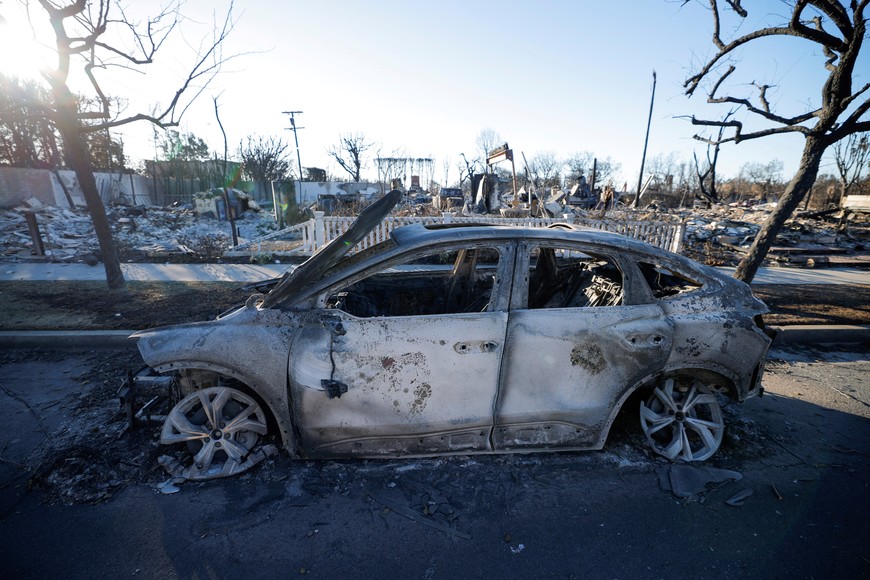 Remains of a Tesla electric car, destroyed by the Palisades Fire are seen, at the Pacific Palisades neighborhood in Los Angeles, California, U.S.  January 13, 2025. REUTERS/Mike Blake