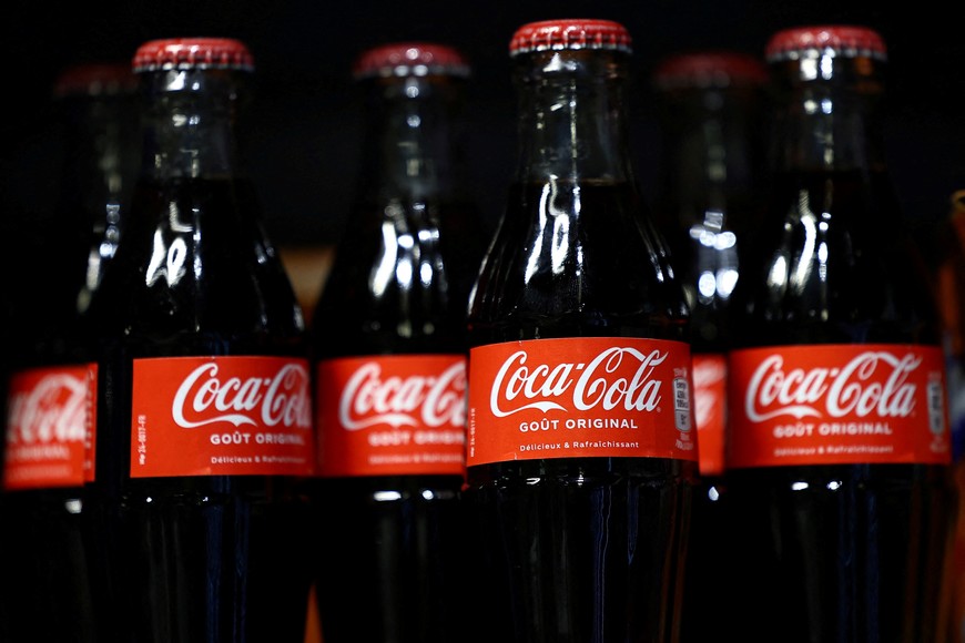 Bottles of Coca-Cola are displayed on a shelf in a supermarket in Paris, France, January 29, 2025. REUTERS/Abdul Saboor