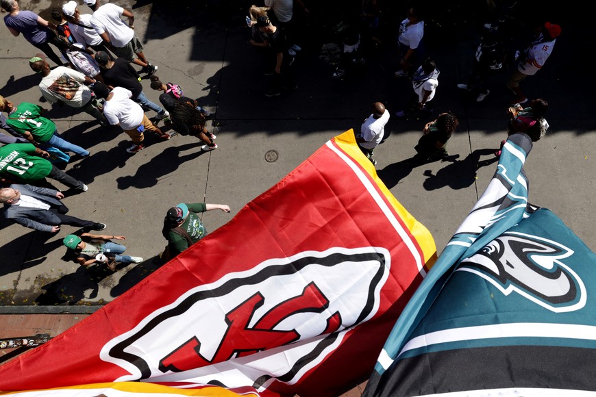 Team flags fly from a balcony on Bourbon Street ahead of the NFL's Super Bowl LIX between the Kansas City Chiefs and the Philadelphia Eagles, in New Orleans, Louisiana, U.S., February 8, 2025. REUTERS/Mike Segar