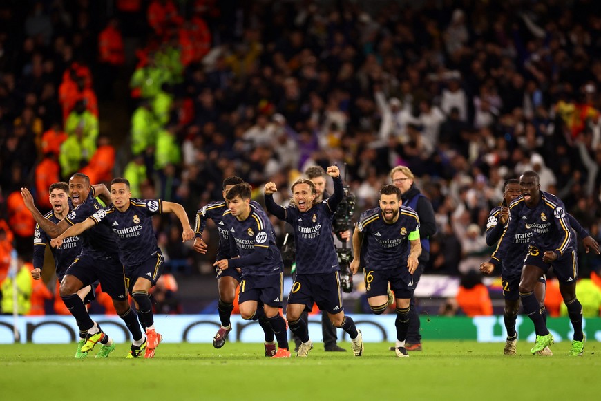 Soccer Football - Champions League - Quarter Final - Second Leg - Manchester City v Real Madrid - Etihad Stadium, Manchester, Britain - April 17, 2024
Real Madrid players celebrate winning the penalty shootout REUTERS/Carl Recine